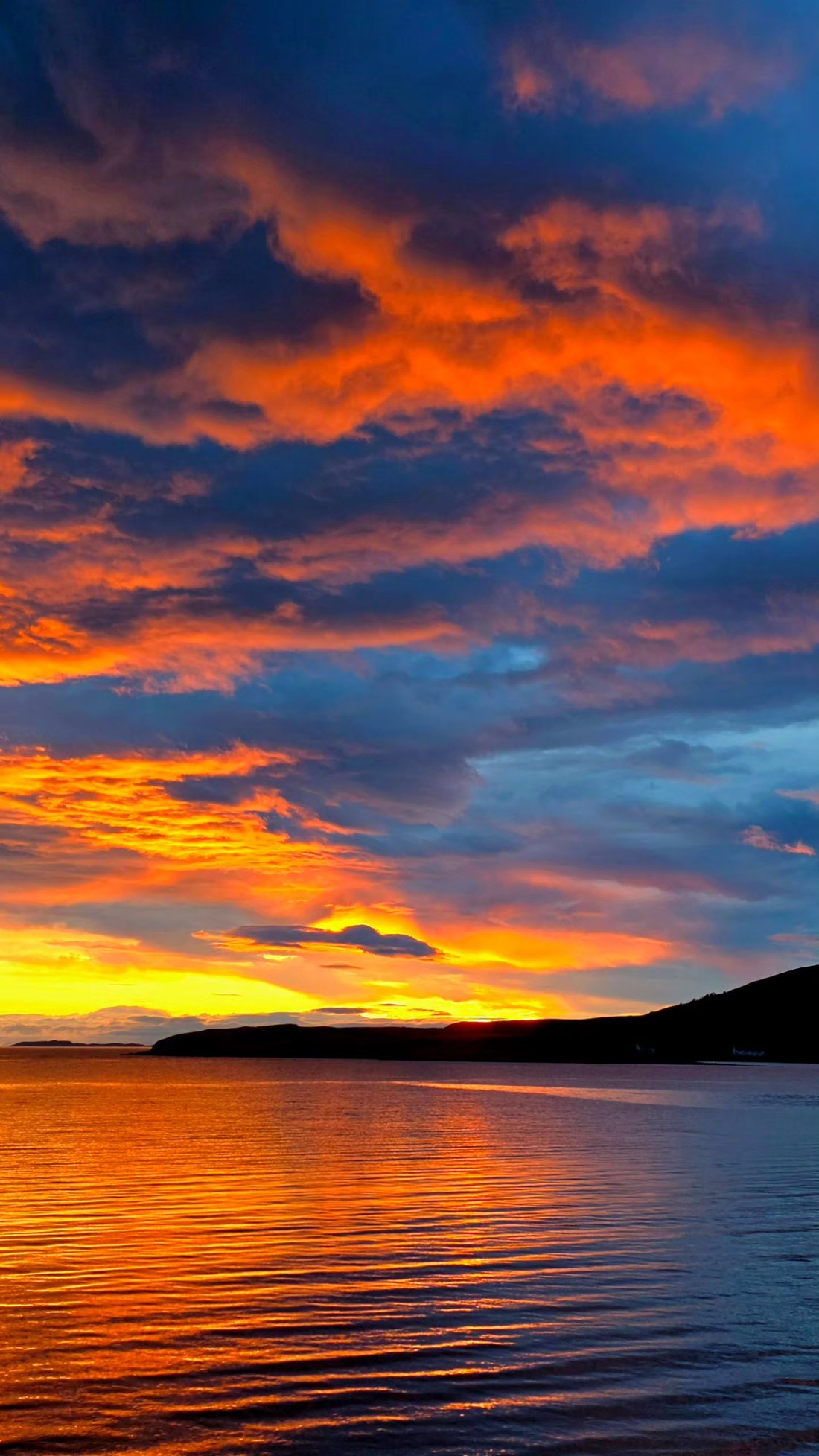 Sunset over a Scottish loch, seen from the campervan