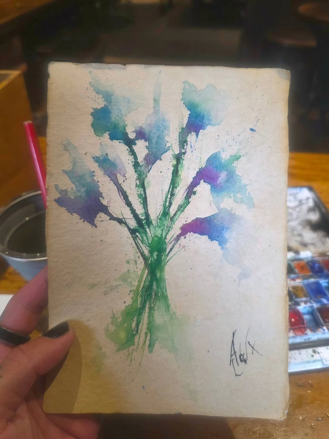 Watercolour study of a blue and purple wildflower bouquet