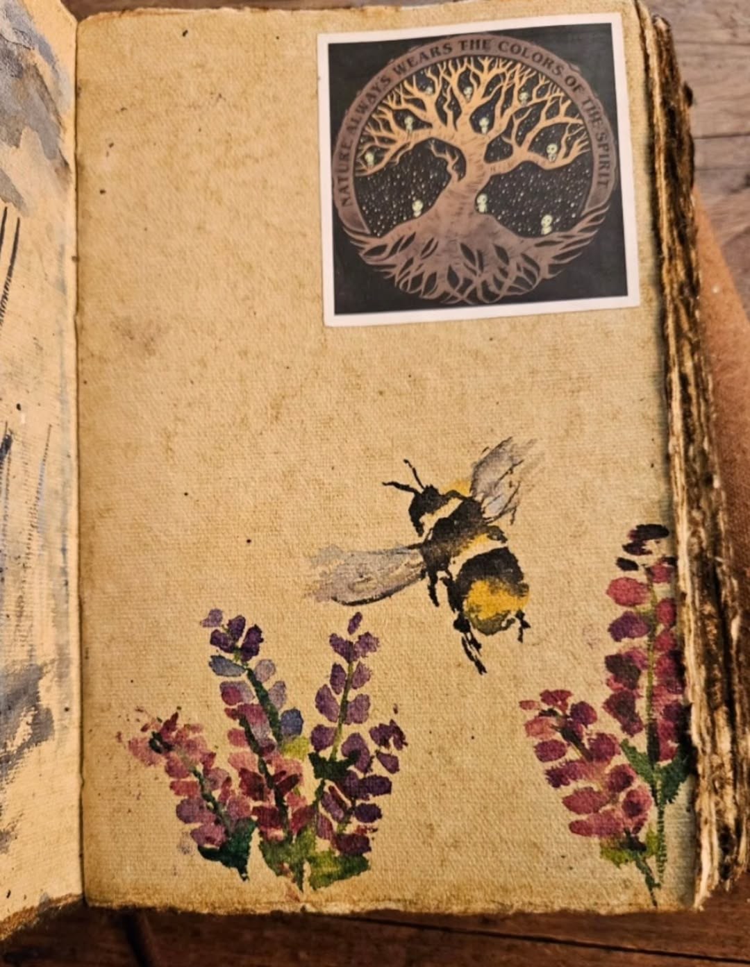 Small watercolour sketchbook study of a bumblebee on lavender